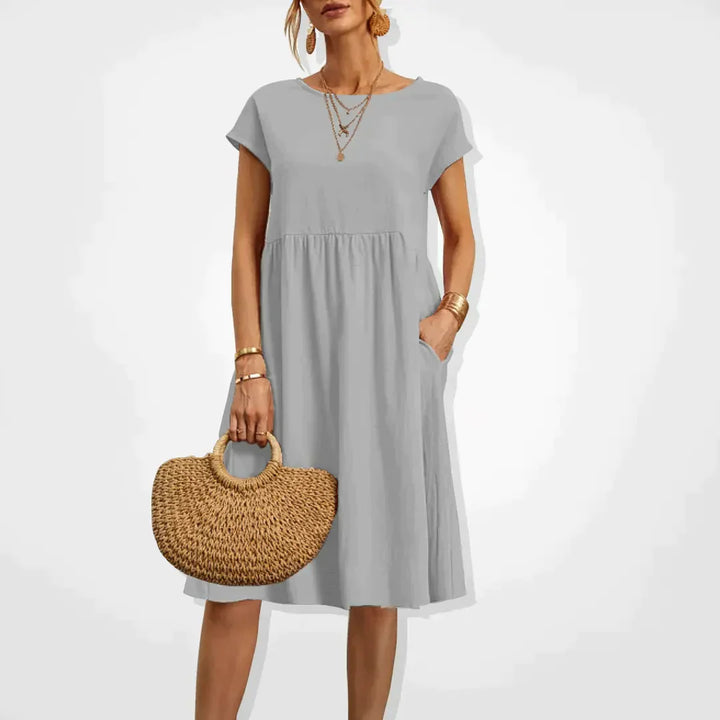 Zomerjurk voor dames in empirestijl met korte mouwen en zakken