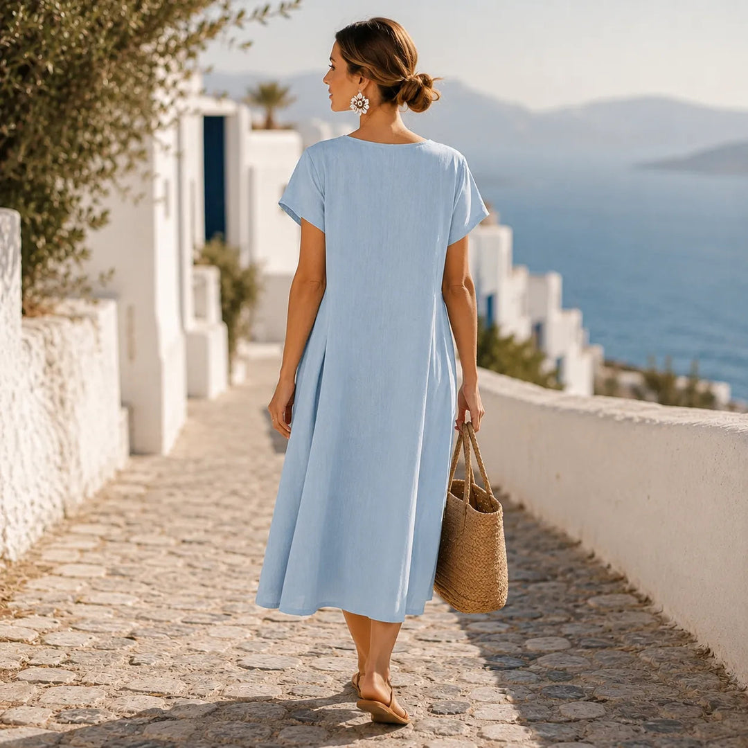 Asymmetrische midi-jurk met knoopjes