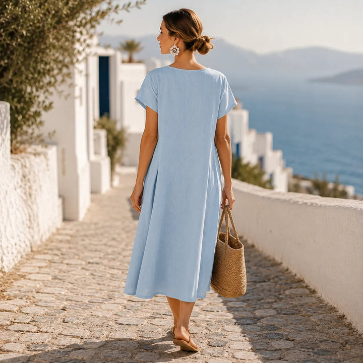 Asymmetrische midi-jurk met knoopjes