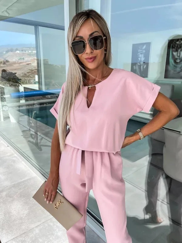Elegante damesjumpsuit met riem en v-hals